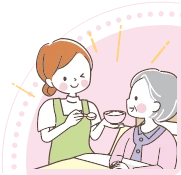 食事のサポートをする介護職員のイラスト